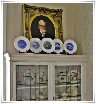 Image showing Shenango china plates and a vintage oil portrait as example items for the Appraisal Fair.