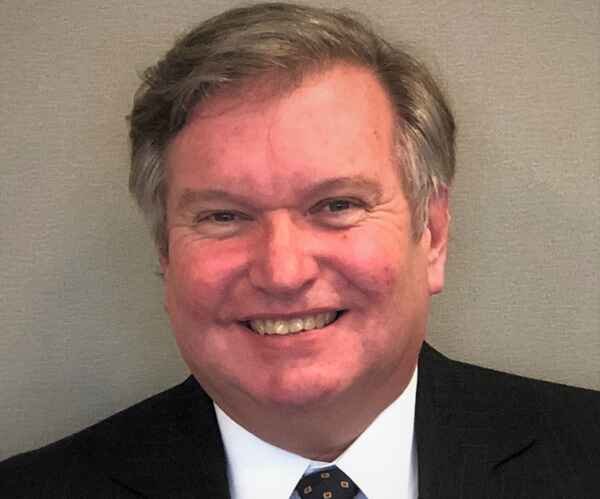 Dan Vogler in business suit.