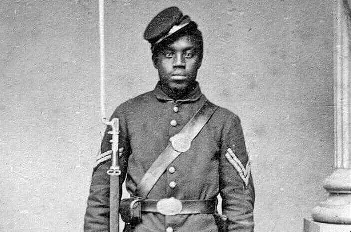 Black Civil War soldier in full uniform.