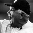 Photo of Lindy Lauro wearing cap and yelling.